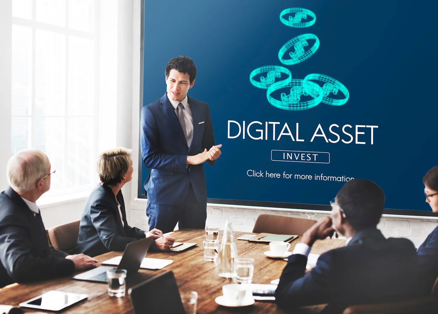 Business meeting discussing digital assets, featuring a presenter in a suit, digital currency graphics, and a focus on investment strategies.