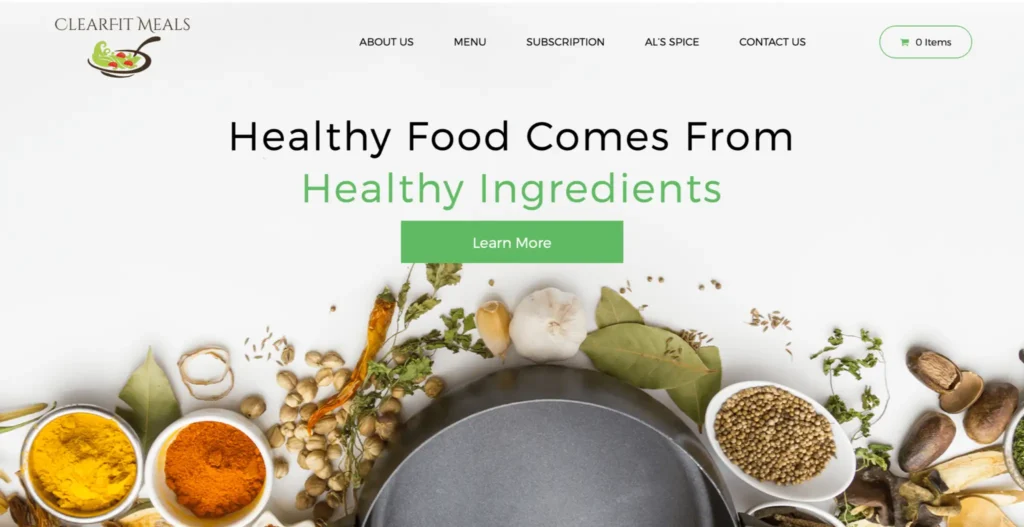 ClearFit Meals website homepage featuring a pot surrounded by fresh spices and ingredients with the phrase "Healthy Food Comes From Healthy Ingredients" prominently displayed.