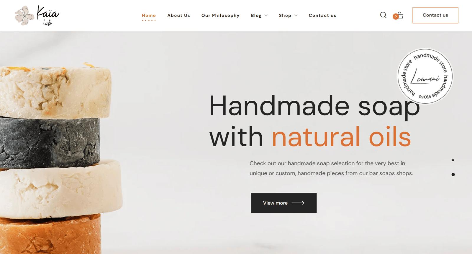 Handmade soap bars stacked, featuring natural oils, highlighting Kaia Labs' commitment to all-natural skincare products.