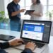 Professional web designer engaged in website redesign process, showcasing modern workspace elements for enhanced digital presence.
