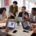 Stylish professionals collaborating on digital marketing strategies in a modern workspace