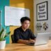Entrepreneur in a modern workspace with e-commerce elements highlighting online store design